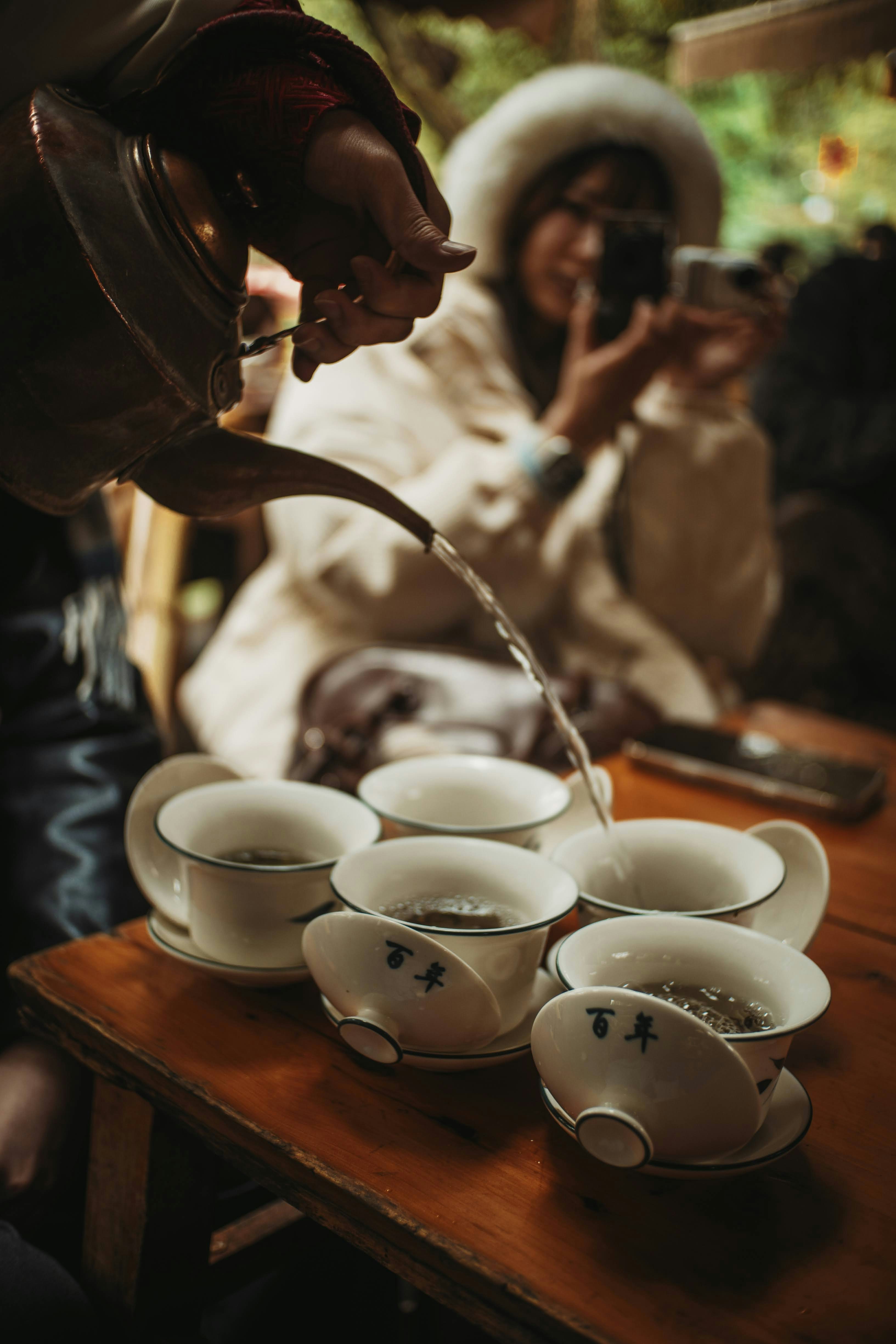 People drinking hot tea at restaurant