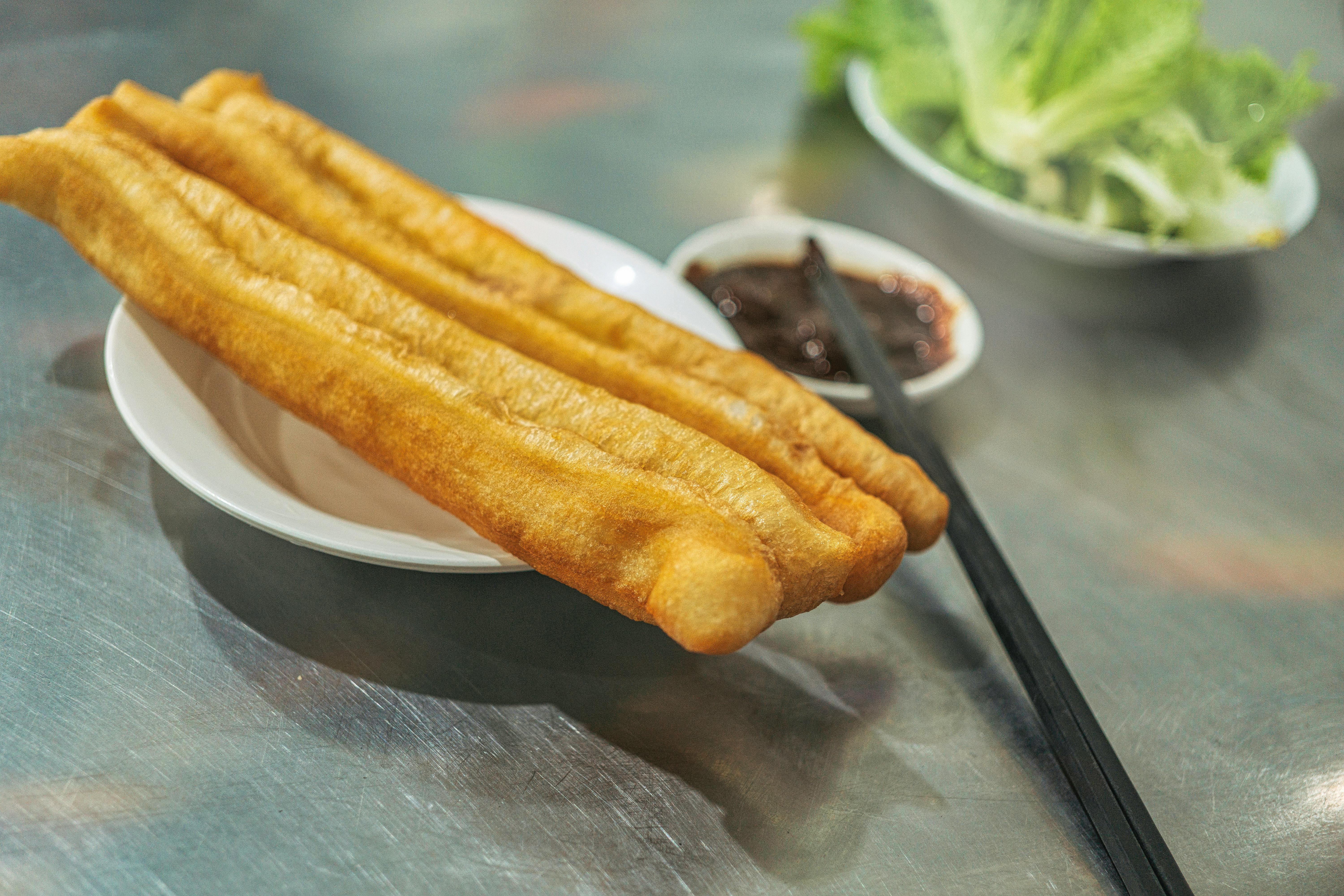 Chinese breakfast spread with congee and youtiao